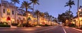 Christmas lights as sunrises over The French restaurant along 5th Street in Old Naples, Florida